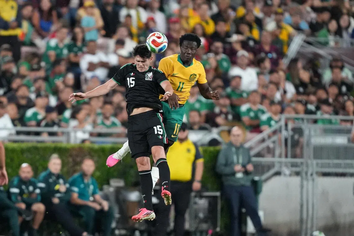 May 30, 2026; Pasadena, California, USA; Mexico centre back Israel Reyes (15) and Australia player Nestory Irankunda (11) head the ball in the second half at Rose Bowl Stadium. Mandatory Credit: Kirby Lee-Imagn Images